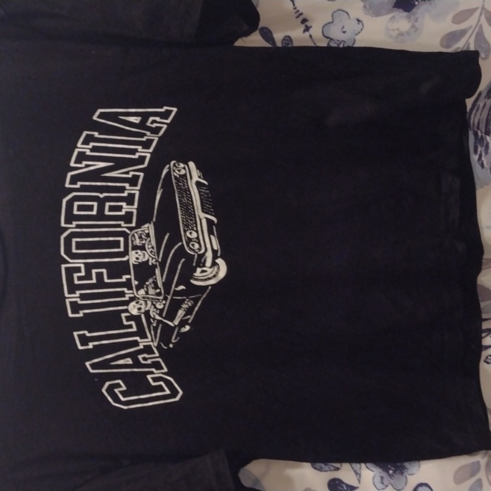 Black graphic tee shirt Xsmall no rips no stains used.